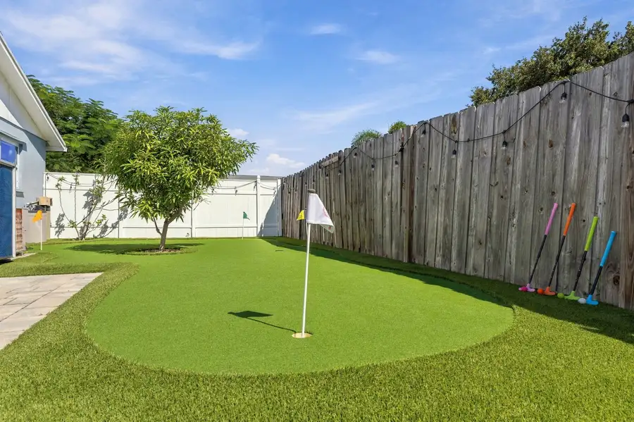 Backyard putting green with flag