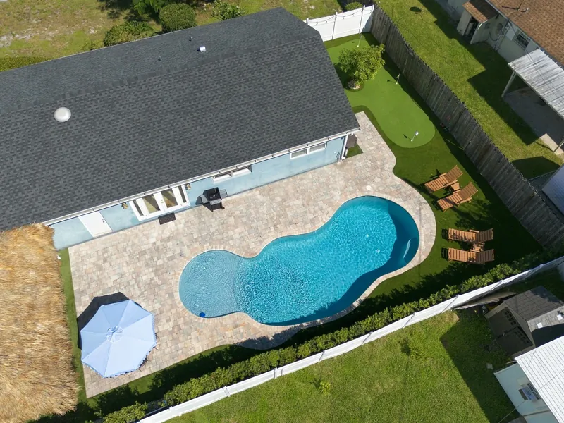 Aerial view of pool and tiki